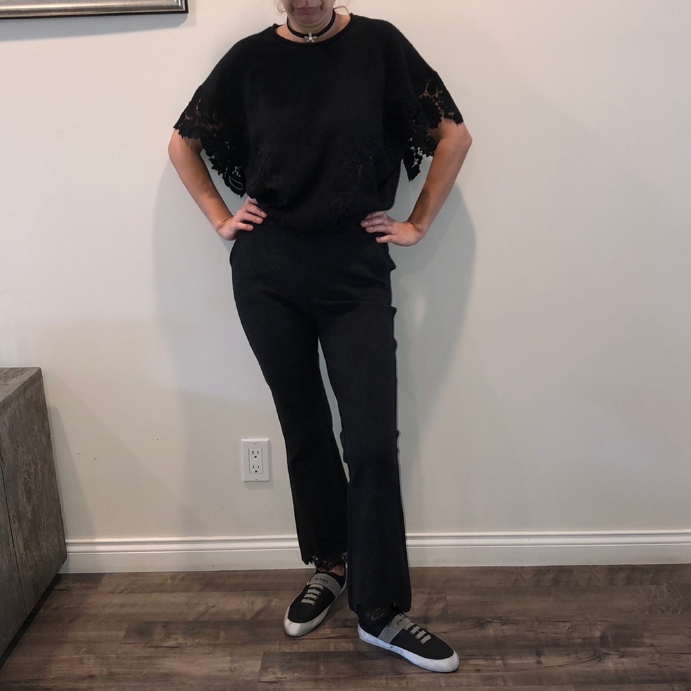 Black top with lace details.